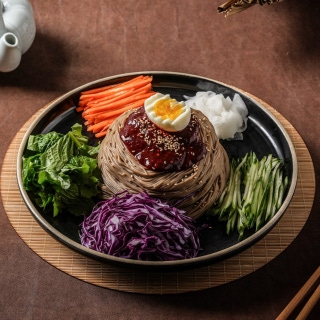 Spicy mixed buckwheat noodles on a platter