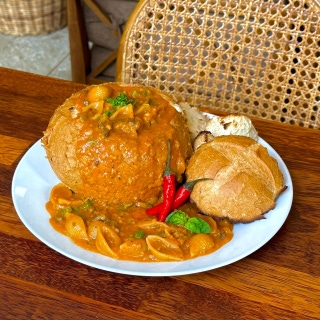 Spicy creamy tomato pasta in a bread bowl