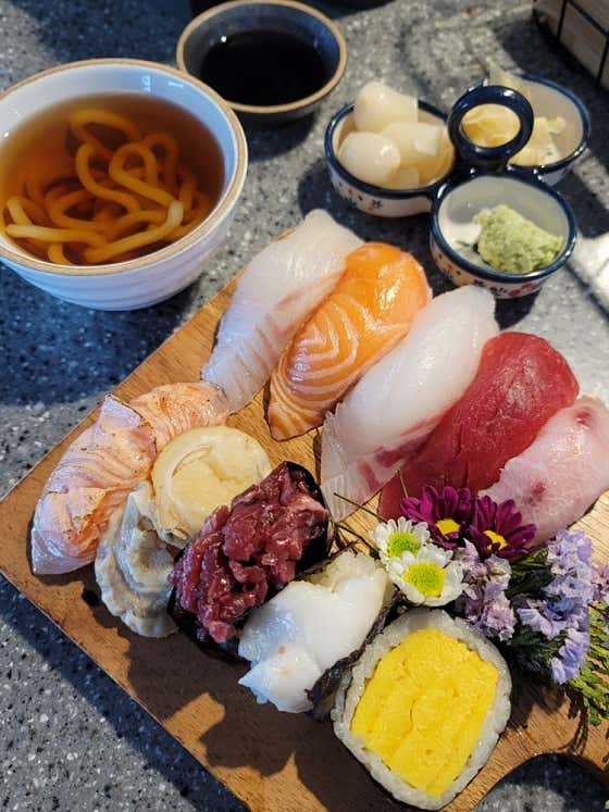 Fish dish and accompaniments at Muhwa Sikdang