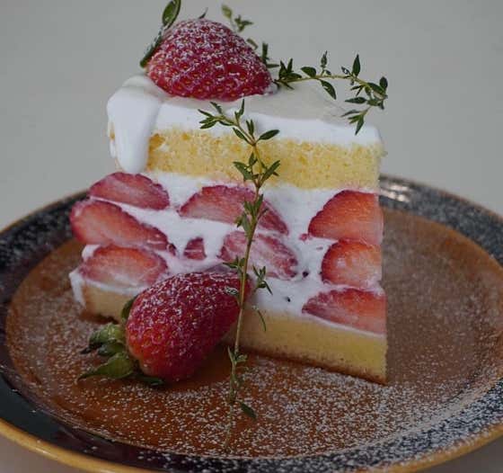 Dessert with strawberries at Hit Coffee Roasters