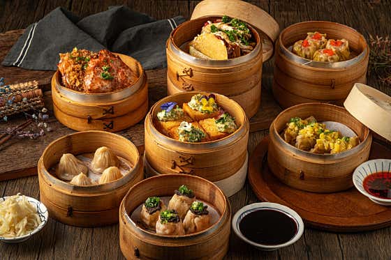 Assorted Panda Dim Sum dishes in a wooden steamer