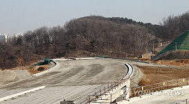 장뇌삼밭 보상 시비..광교신도시 도로개설 차질