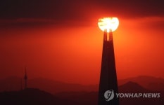 롯데월드타워에 걸린 태양