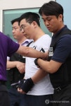 압송되는 창원 골프연습장 살해 용의자