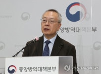 질문에 답변하는 김중곤 예방접종 피해조사반장