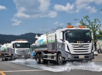 도로 먼지와 주변 더위도 한 번에