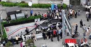 지하철역 입구로 진입한 승용차