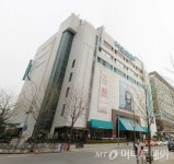이랜드 2001 아울렛 직접인수 대신 간접투자