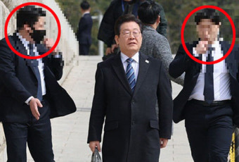 ‘HID 요원 권총 암살’ 위협에…이재명, 경호원 호위 받으며 이동 포착