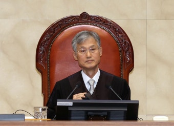 도로 ‘흰색 실선’ 넘다 사고나도, 보험있으면 처벌 면제된다