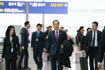 한덕수 “긴 행진곡 중 마지막 악장” 부산엑스포 결전지 출국