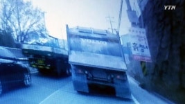 끼어들었다며 덤프트럭으로 들이받아