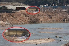텅 빈 침출수 저장탱크, 왜? 방역복 없이 매몰지 위에서 작업