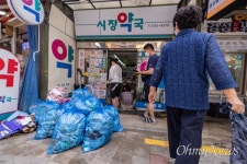 [오마이포토] 폭우 내려 망가진 시장, 복구에 한숨