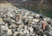 농업용수 저수지에 건축 폐기물 방치