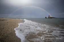GREECE NATURE RAINBOW OVER A SHIPWRECK