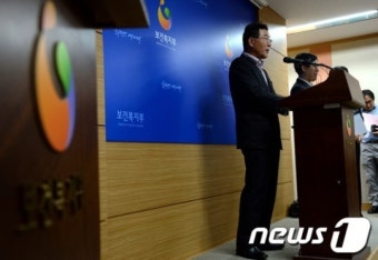 기초연금 합의문 발표하는 김상균 위원장