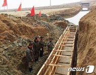 노동신문 관해협동농장, 알곡 증산에 성실한 한 땀