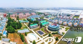 무릉도원으로 변모한 7년 전 평양 장천남새협동농장