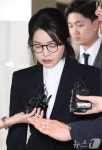 [뉴스1 PICK]'첫 특검 조사' 김건희, 고개 푹 숙인 채 말없이 귀가