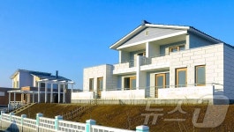 北, 항구구역 우산목화농장에 새 문화주택들 건설