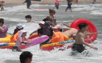 한국 무더운 폭염 계속...낮 최고기온 36도로 이어져