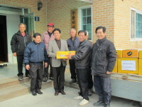 신진전기사업, 주봉3리에 감귤 전달