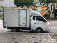 도로에 불법 주·정차 로젠 택배 차량 교통 체증 원인