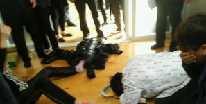 Owner of guest house bows to bereaved families 