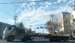 철강 운송 노동자와 ‘과적의 악순환’