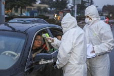 Alarm Grows as Markets Tumble and Death Toll Rises