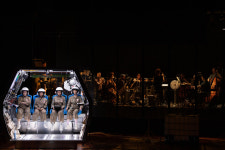 An Opera Takes A.I., Pronatalism and Hustle Culture to Space