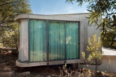 Elevated House Responds To A Rocky Site Through Stylish Design