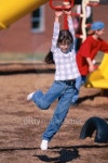 Girl playing on playground, hanging from jungle gym 이미지 (E000066) - 게티이미지뱅크 Girl playing on playground, hanging... 