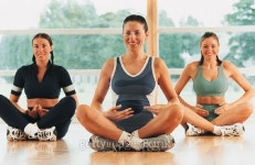 Three women sitting on floor with crossed legs, stretching 이미지 (dv154078b) - 게티이미지뱅크 Three women sitting on floor... 