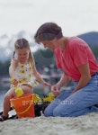 Grandmother and Granddaughter Playing in Sand 이미지 (LS020451) - 게티이미지뱅크 Grandmother and Granddaughter Playing in Sand