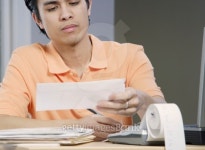 Close-up of a mid adult man looking at an envelope 이미지 (blddb_c0004) - 게티이미지뱅크 Close-up of a mid adult man looking... 
