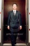 Young businessman stepping out of an elevator 이미지 (blddb_a0019) - 게티이미지뱅크 Young businessman stepping out of an elevator