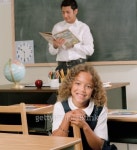 Young female student and a young male teacher in a classroom 이미지 (blddb_a0074) - 게티이미지뱅크 Young female student and... 