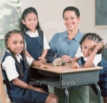 Three young girls and a female teacher sitting together in a class smiling 이미지 (blddb_a0056) - 게티이미지뱅크 Three... 