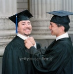 Young male graduate adjusting his friends collar 이미지 (blddb_a0044) - 게티이미지뱅크 Young male graduate adjusting his... 