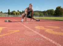 Young man stretching on a running track 이미지 (bldso040058) - 게티이미지뱅크 Young man stretching on a running track