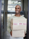 young man holding packages 이미지 (stk316027rkn) - 게티이미지뱅크 young man holding packages