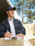 delivery man standing with packages and looking sideways 이미지 (stk316004rkn) - 게티이미지뱅크 delivery man standing with... 