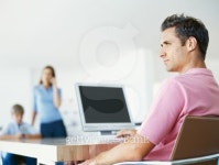 mid adult man sitting in front of a computer 이미지 (stk326005rkn) - 게티이미지뱅크 mid adult man sitting in front of a computer