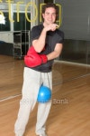 Man putting on boxing gloves in the gym 이미지 (93824967) - 게티이미지뱅크 Man putting on boxing gloves in the gym