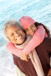 Grandmother playing with granddaughter by ocean 이미지 (78154765) - 게티이미지뱅크 Grandmother playing with granddaughter by... 
