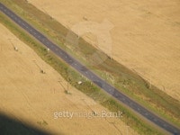 Road across field with telegraph pole without car. 이미지 (90090270) - 게티이미지뱅크 Road across field with telegraph pole... 