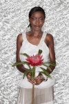 Portrait of African woman holding King Protea flower 이미지 (74009510) - 게티이미지뱅크 Portrait of African woman holding... 