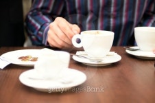 Man sitting at cafe table, bill and change on saucer, close-up 이미지 (200469433-001) - 게티이미지뱅크 Man sitting at... 